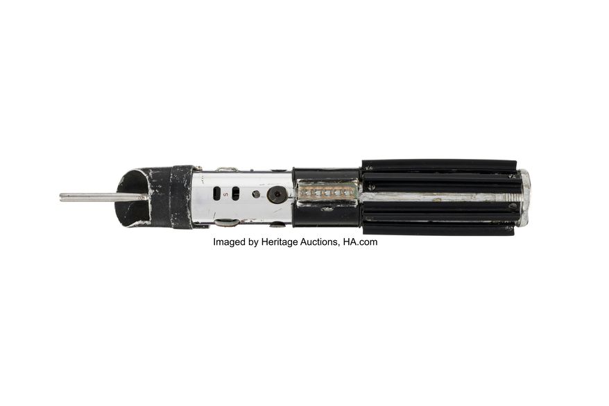 This image released by Heritage Auctions shows a lightsaber used by the character Darth Vader used in the film "The Empire Strikes Back." (Heritage Auctions via AP)