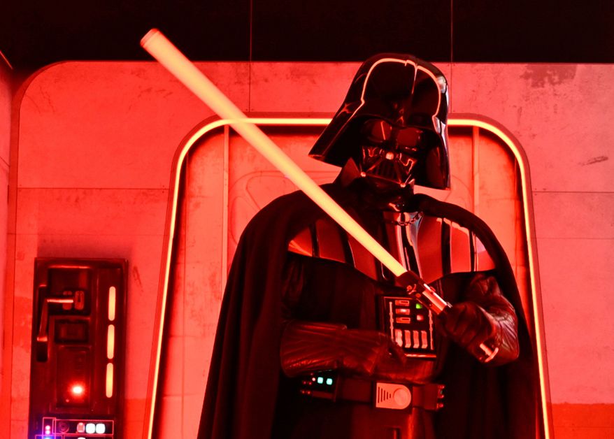 A Darth Vader-costumed character poses at the Hasbro and Amazon Star Wars interactive Imperial March experience at the Empire State Building on March 21, 2024, in New York. (Photo by Evan Agostini/Invision/AP, File)