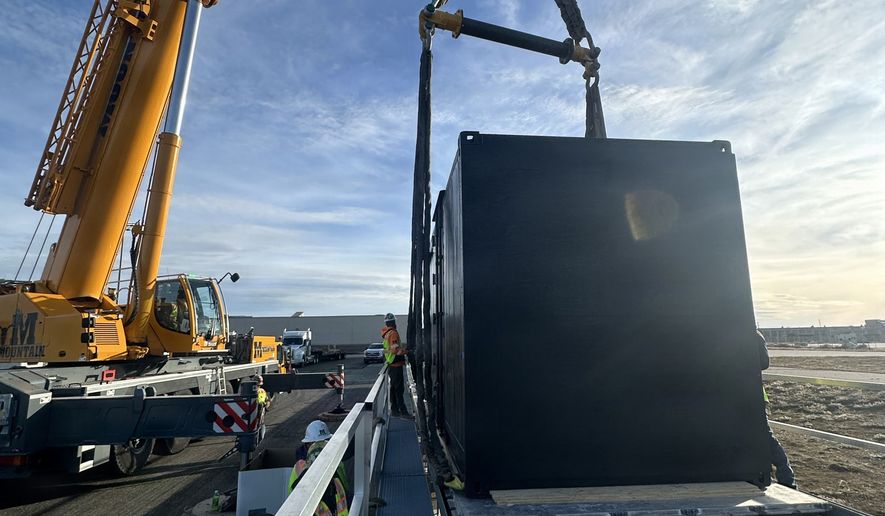 Crews unload containerized nuclear power reactor at Hill Air Force Base, Utah, Feb. 15, 2026. The system is part of an interagency demonstration evaluating the feasibility of rapidly deploying nuclear power using strategic airlift. (Courtesy photo by Tech. Sgt. William McCalmant)