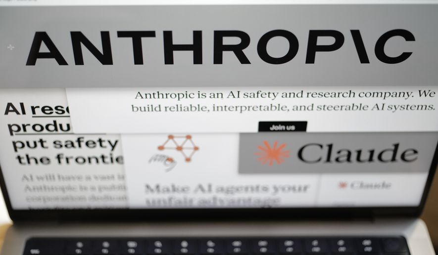 Pages from the Anthropic website and the company's logos are displayed on a computer screen in New York on Thursday, Feb. 26, 2026. (AP Photo/Patrick Sison, File)