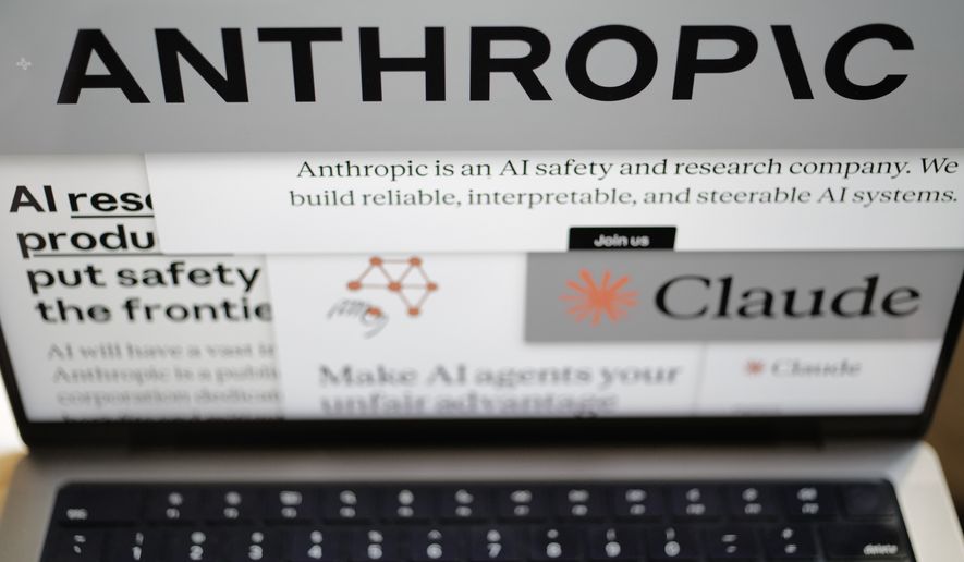 Pages from the Anthropic website and the company's logos are displayed on a computer screen in New York on Thursday, Feb. 26, 2026. (AP Photo/Patrick Sison, File)