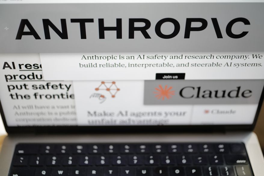 Pages from the Anthropic website and the company's logos are displayed on a computer screen in New York on Thursday, Feb. 26, 2026. (AP Photo/Patrick Sison, File)
