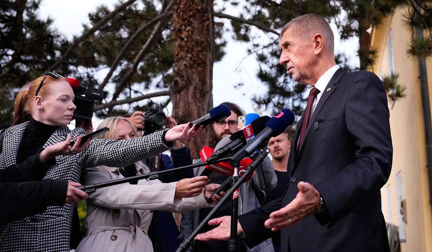 Czech Republic's Prime Minister Andrej Babis talks to media after casting his vote during senate and local elections in Pruhonice, Czech Republic, Friday, Oct. 9, 2026. (AP Photo/Petr David Josek)