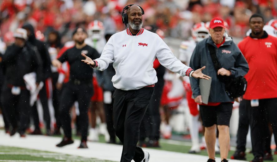Maryland head coach Michael Locksley, center, reacts to a referee's call during the first half of an NCAA college football game against Ohio State, Saturday, Oct. 10, 2026, in Columbus, Ohio. (AP Photo/Jay LaPrete)