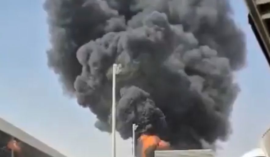 This image from video obtained and verified by AP shows thick black smoke and flames rising from a fire at King Khalid International Airport in Riyadh, Saudi Arabia, Friday, Oct. 9, 2026. (UGC via AP)