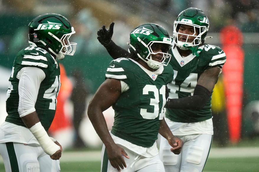New York Jets linebacker David Bailey (31) celebrates with teammate linebacker Jamien Sherwood (44) after a sack during the second half of an NFL football game against the Cleveland Browns, Sunday, Oct. 11, 2026, in East Rutherford, N.J. (AP Photo/Seth Wenig)