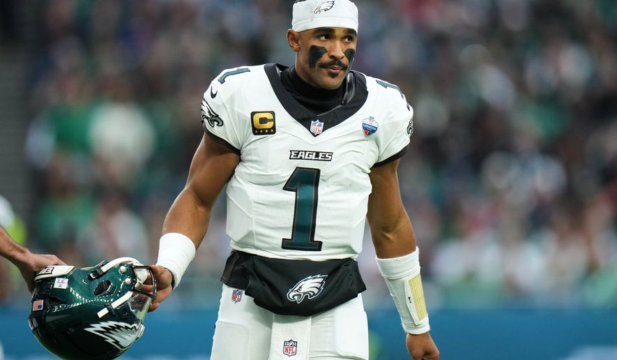 Philadelphia Eagles quarterback Jalen Hurts (1) stands on the field during an NFL football game against Jacksonville Jaguars in London, Sunday, Oct. 11, 2026. (AP Photo/Alastair Grant)