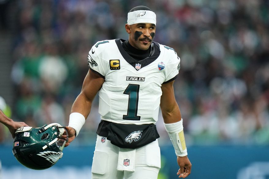 Philadelphia Eagles quarterback Jalen Hurts (1) stands on the field during an NFL football game against Jacksonville Jaguars in London, Sunday, Oct. 11, 2026. (AP Photo/Alastair Grant)