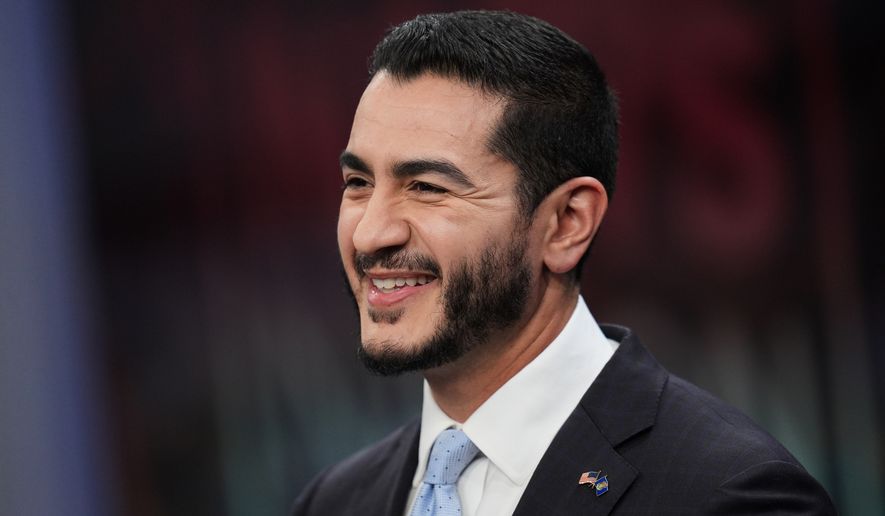 Democratic nominee for U.S. Senate Abdul El-Sayed, smiles during a televised debate with Republican nominee for U.S. Senate Mike Rogers at WOOD-TV, on Thursday, Oct. 8, 2026, in Grand Rapids, Mich. (AP Photo/Paul Sancya, Pool)