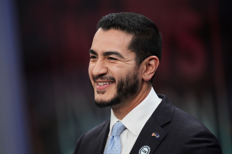 Democratic nominee for U.S. Senate Abdul El-Sayed, smiles during a televised debate with Republican nominee for U.S. Senate Mike Rogers at WOOD-TV, on Thursday, Oct. 8, 2026, in Grand Rapids, Mich. (AP Photo/Paul Sancya, Pool)