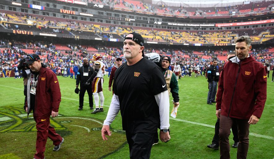 Washington Commanders head coach Dan Quinn leaves the field after an NFL football game against the New York Giants in Landover, Md., Sunday, Oct. 11, 2026. (AP Photo/Nick Wass)