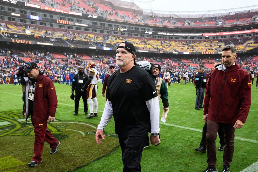 Washington Commanders head coach Dan Quinn leaves the field after an NFL football game against the New York Giants in Landover, Md., Sunday, Oct. 11, 2026. (AP Photo/Nick Wass)