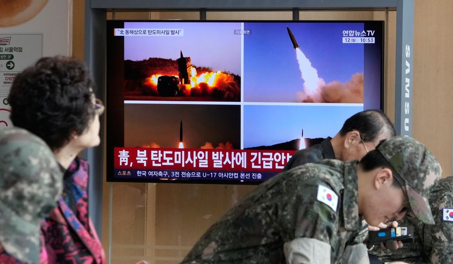 A TV screen shows file images of North Korean missiles launch during a news program at Seoul Railway Station in Seoul, South Korea, Monday, Oct. 12, 2026. (AP Photo/Ahn Young-joon)