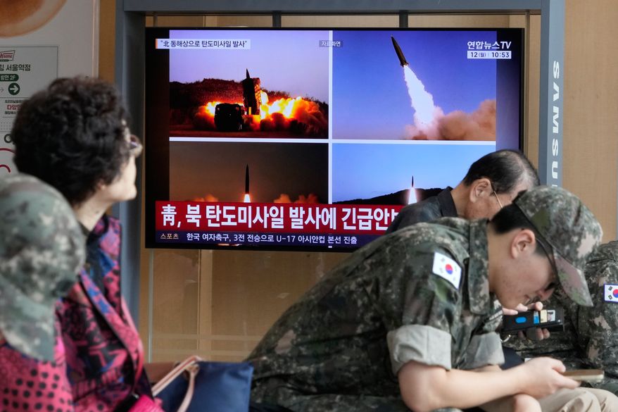 A TV screen shows file images of North Korean missiles launch during a news program at Seoul Railway Station in Seoul, South Korea, Monday, Oct. 12, 2026. (AP Photo/Ahn Young-joon)
