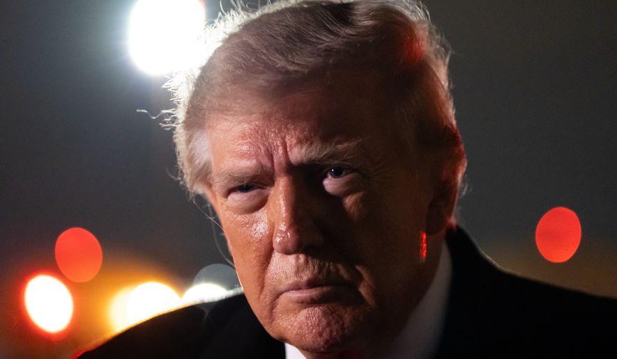 President Donald Trump speaks with reporters as he arrives on Air Force One, Saturday, Oct. 10, 2026, at Joint Base Andrews, Md. (AP Photo/Alex Brandon)