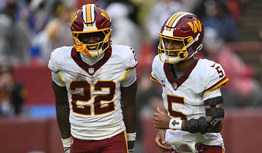 Washington Commanders running back Jacory Croskey-Merritt (22) celebrates with quarterback Jayden Daniels (5) after the quarterback’s 38-yard touchdown run against the New York Giants at Northwest Stadium in Landover, Maryland, October 11, 2026. (Photo by Brian Murphy for the Washington Times)