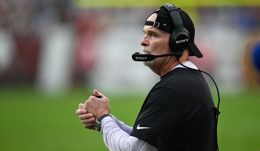 Washington Commanders head coach Dan Quinn observes from the sidelines after his defense allows a New York Giants touchdown pass to cut the score to 19-12 at Northwest Stadium in Landover, Maryland, October 11, 2026. (Photo by Brian Murphy for the Washington Times)