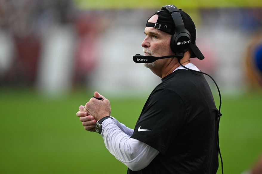 Washington Commanders head coach Dan Quinn observes from the sidelines after his defense allows a New York Giants touchdown pass to cut the score to 19-12 at Northwest Stadium in Landover, Maryland, October 11, 2026. (Photo by Brian Murphy for the Washington Times)
