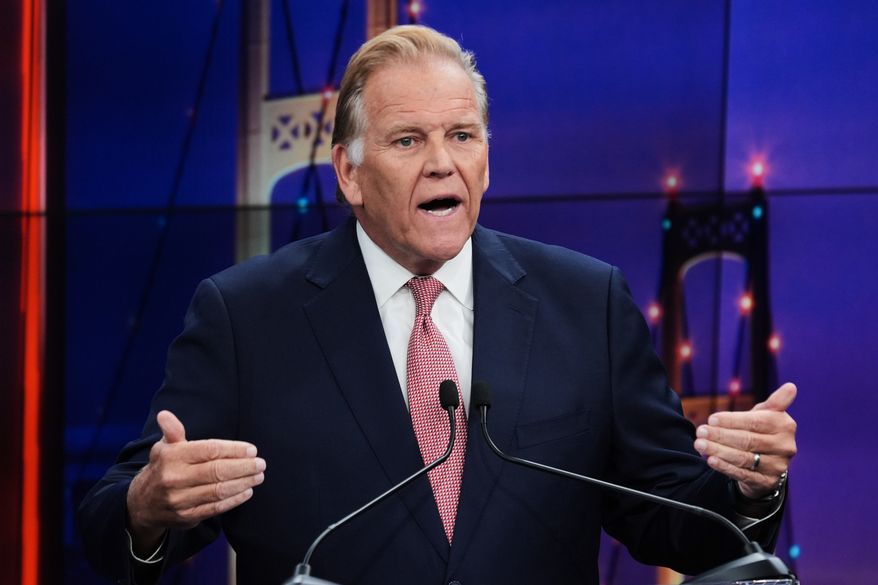 Republican nominee for U.S. Senate Mike Rogers, makes a point during a televised debate with Democratic nominee for U.S. Senate Abdul El-Sayed, at WOOD-TV, on Thursday, Oct. 8, 2026, in Grand Rapids, Mich. (AP Photo/Paul Sancya, Pool)