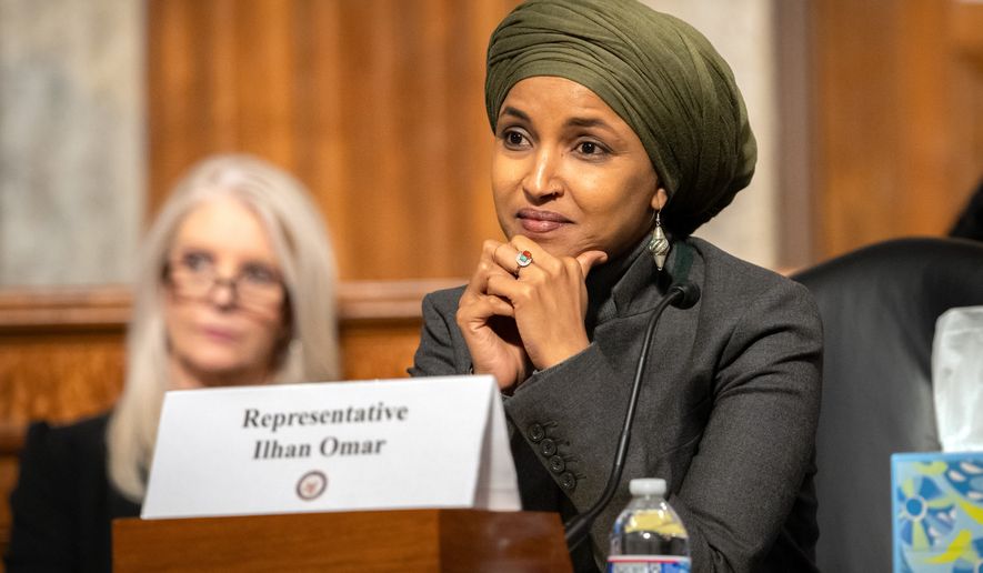 Rep. Ilhan Omar, D-Minn., listens during a Congressional spotlight hearing on Capitol Hill, Tuesday, Sept. 22, 2026, in Washington. (AP Photo/Mark Schiefelbein)