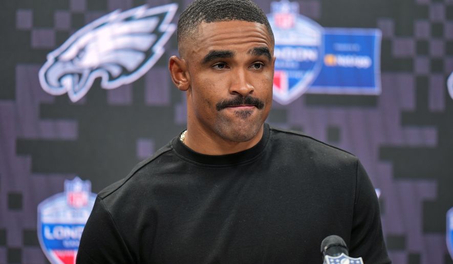 Philadelphia Eagles quarterback Jalen Hurts (1) attends a press conference after an NFL football game against Jacksonville Jaguars in London, Sunday, Oct. 11, 2026. (AP Photo/Alastair Grant)