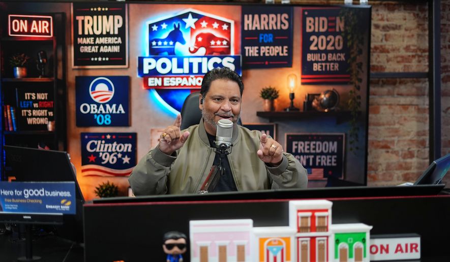 Victor Martinez, who runs La Mega 101.7, a Spanish-language radio station in Pennsylvania's Lehigh Valley, hosts a politics talk show from his studio in Allentown, Pa., Tuesday, Sept. 29, 2026. (AP Photo/Matt Rourke)