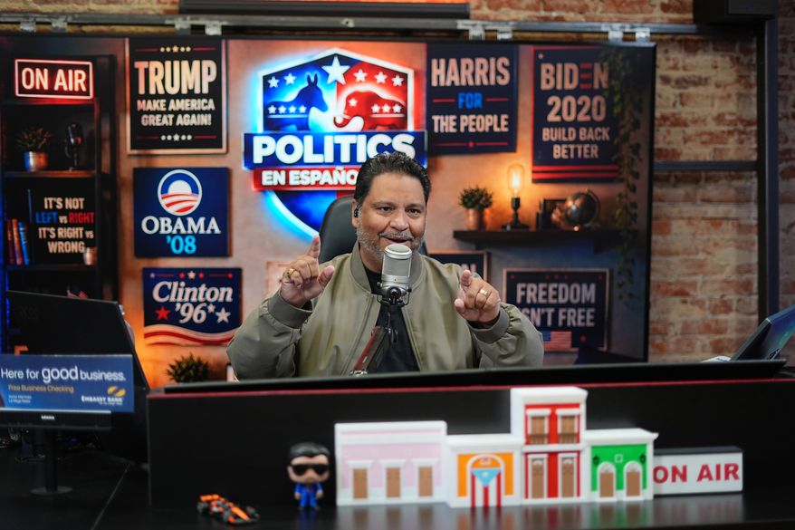 Victor Martinez, who runs La Mega 101.7, a Spanish-language radio station in Pennsylvania's Lehigh Valley, hosts a politics talk show from his studio in Allentown, Pa., Tuesday, Sept. 29, 2026. (AP Photo/Matt Rourke)