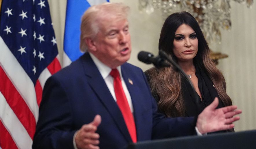 President Donald Trump speaks at a reception celebrating Greek Independence Day, in the East Room of the White House, Thursday, March 26, 2026, in Washington, as U.S. Ambassador to Greece Kimberly Guilfoyle, listens. (AP Photo/Julia Demaree Nikhinson)