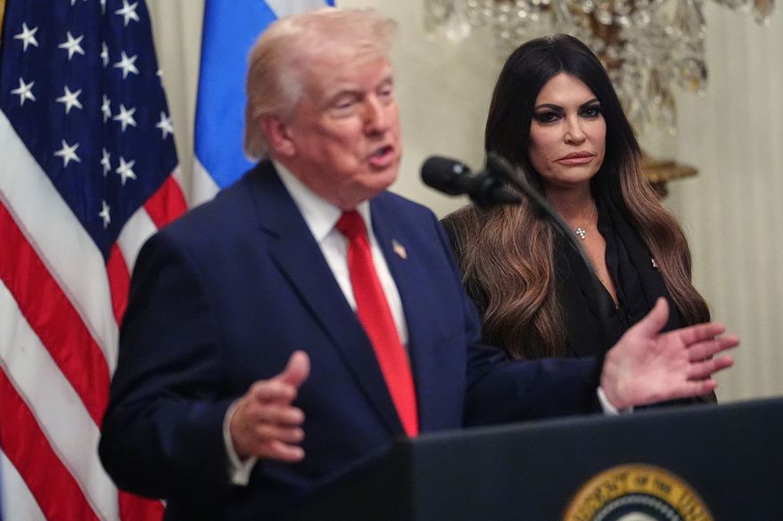 President Donald Trump speaks at a reception celebrating Greek Independence Day, in the East Room of the White House, Thursday, March 26, 2026, in Washington, as U.S. Ambassador to Greece Kimberly Guilfoyle, listens. (AP Photo/Julia Demaree Nikhinson)