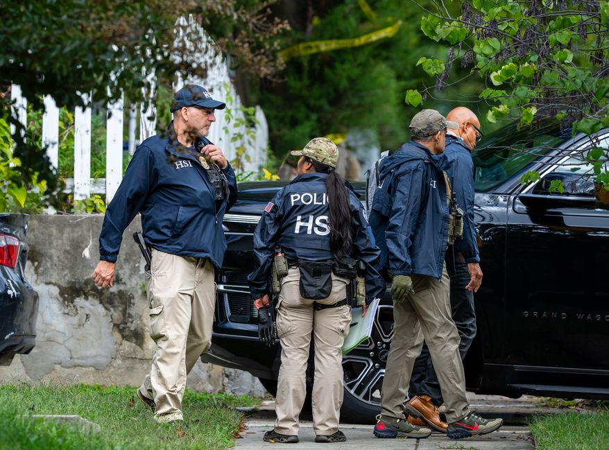 Homeland Security officers leave the Washington residence of Rep. Ilhan Omar, D-Minn., after a search, Monday, Oct. 12, 2026. (AP Photo/J. Scott Applewhite)