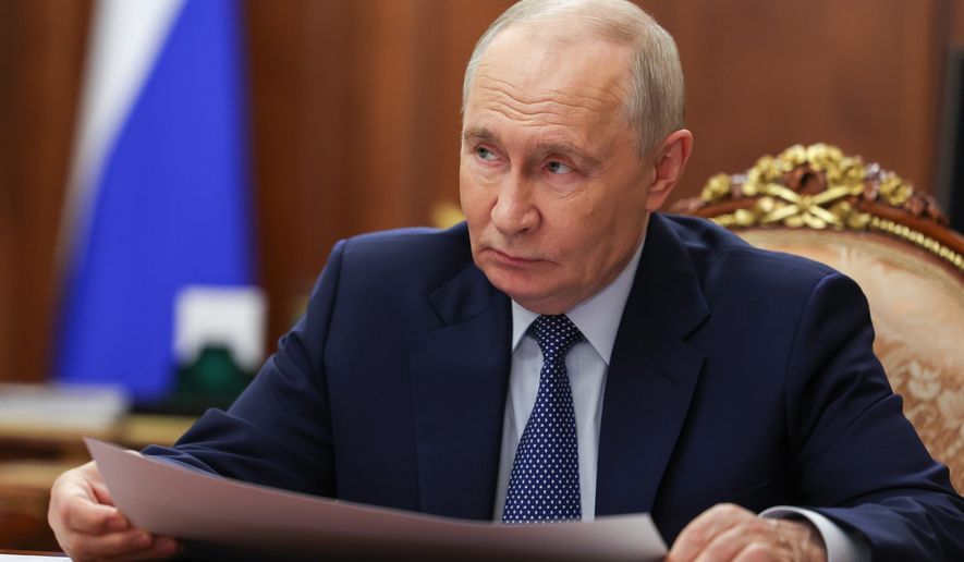 Russian President Vladimir Putin listens to head of the Delovaya Rossiya (Business Russia) National Public Organisation Alexei Repik during their meeting at the Kremlin in Moscow, Monday, Oct. 12, 2026. (Mikhail Metzel, Sputnik, Kremlin Pool Photo via AP)