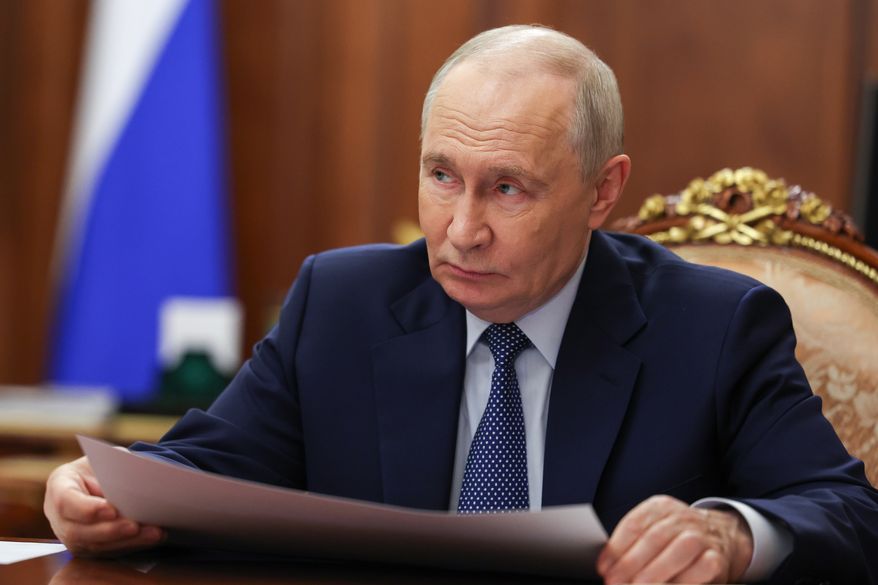 Russian President Vladimir Putin listens to head of the Delovaya Rossiya (Business Russia) National Public Organisation Alexei Repik during their meeting at the Kremlin in Moscow, Monday, Oct. 12, 2026. (Mikhail Metzel, Sputnik, Kremlin Pool Photo via AP)