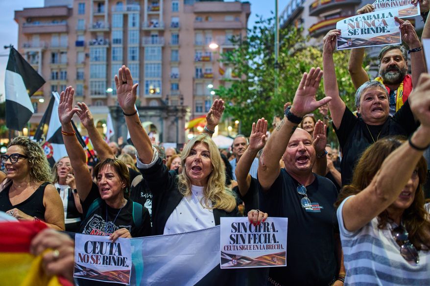 Local residents protest the Spanish government's handling of the Ceuta border crisis, two months after it occurred, in the Spanish enclave of Ceuta, Wednesday, Sept. 30, 2026. Banners read in Spanish: "Ceuta does not give up". (AP Photo/Bernat Armangue)