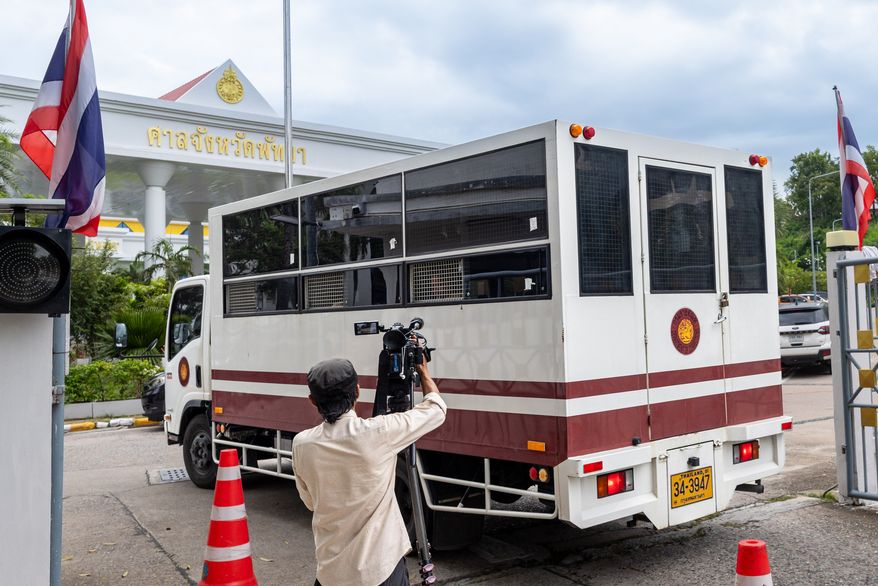 A prison vehicle carrying Simon Peter Carman, an Australian man charged with killing a teenage girl, arrives at Pattaya Provincial Court in Pattaya, Thailand, Monday, Oct. 12, 2026. (AP Photo/Wason Wanichakorn)