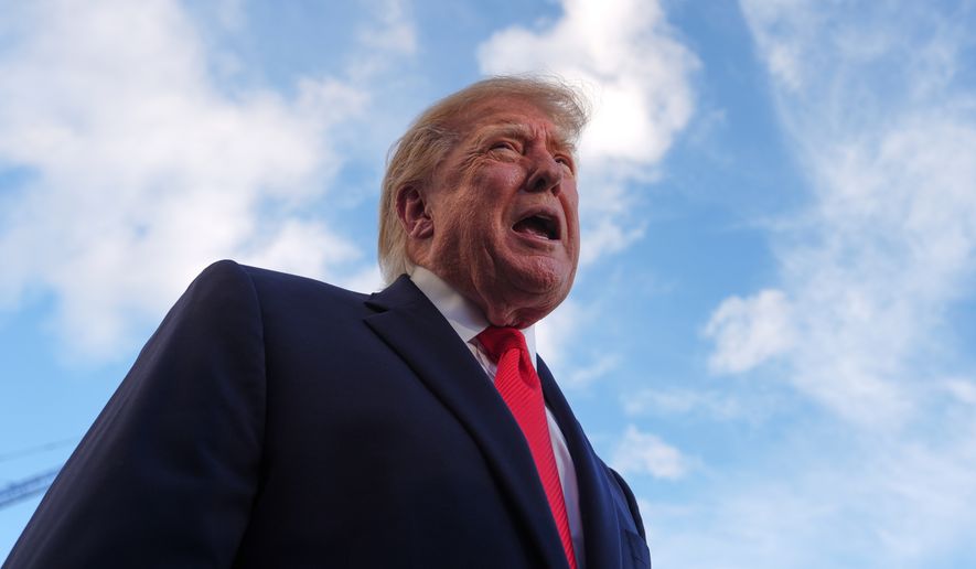 President Donald Trump speaks with reporters before walking to board Marine One on the South Lawn of the White House, Monday, Oct. 12, 2026, in Washington. (AP Photo/Julia Demaree Nikhinson)