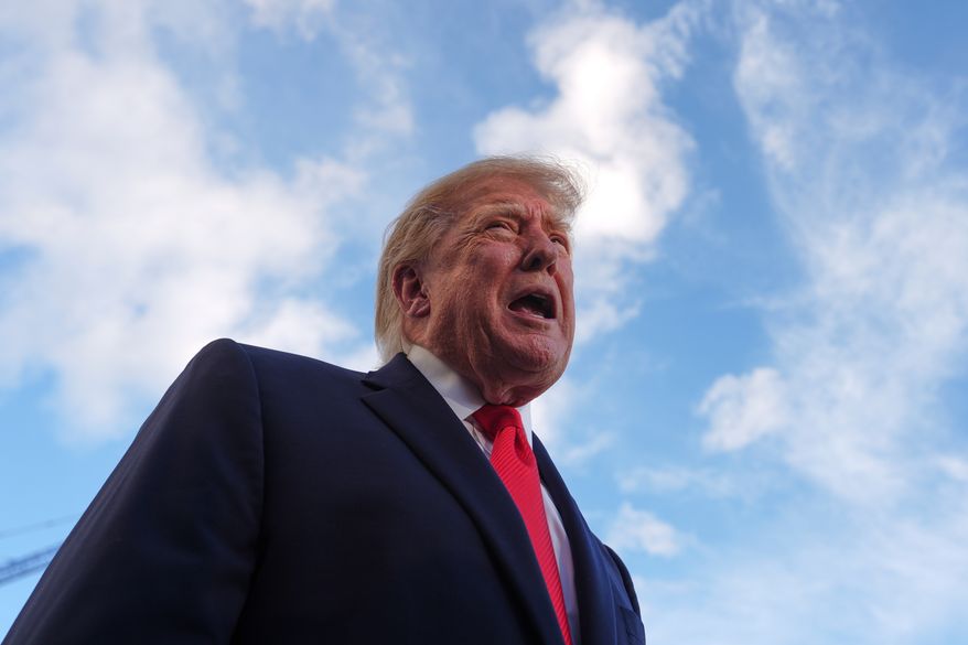 President Donald Trump speaks with reporters before walking to board Marine One on the South Lawn of the White House, Monday, Oct. 12, 2026, in Washington. (AP Photo/Julia Demaree Nikhinson)