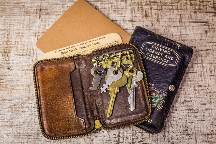 FILE photo of an old leather key holder and wallet with a vintage driver's license. (Photo by CL Shebley on Shutterstock)