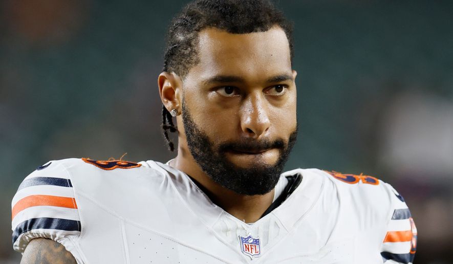 FILE - Chicago Bears defensive lineman Montez Sweat leaves the field after an NFL preseason football game against the Cincinnati Bengals in Cincinnati, Aug. 22, 2026. (AP Photo/Jay LaPrete, File)
