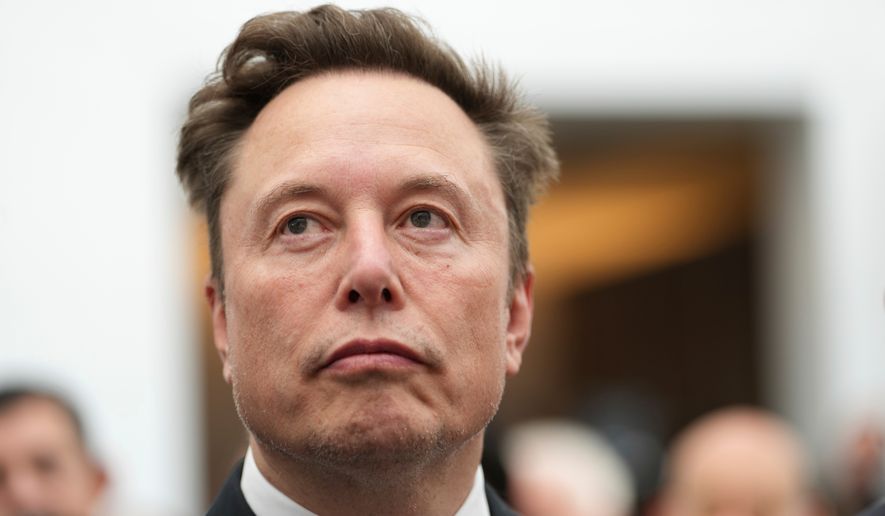 Elon Musk listens as President Donald Trump speaks during an event at the U.S. Institute of Peace, Oct. 8, 2026, in Washington. (AP Photo/Julia Demaree Nikhinson, File)