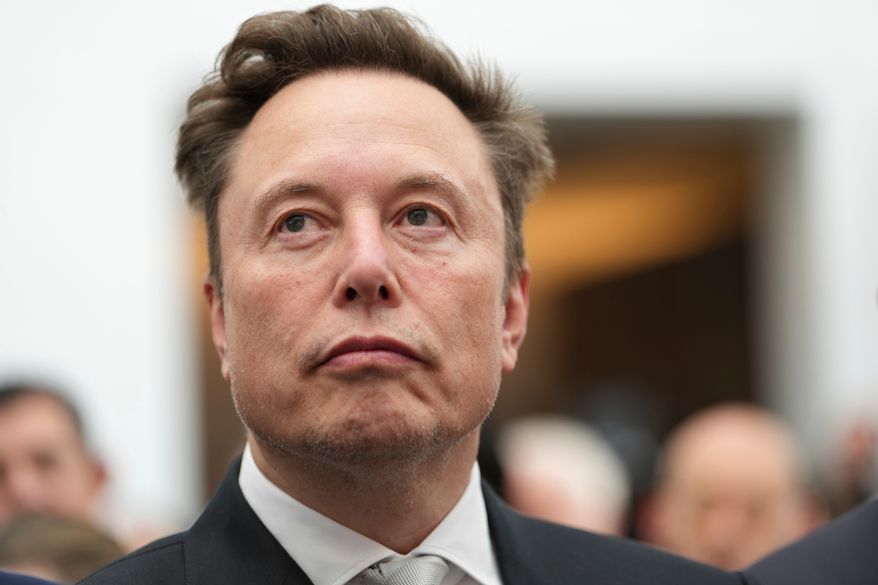 Elon Musk listens as President Donald Trump speaks during an event at the U.S. Institute of Peace, Oct. 8, 2026, in Washington. (AP Photo/Julia Demaree Nikhinson, File)