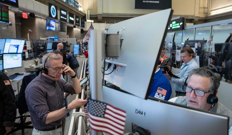 Options traders work on the floor of the New York Stock Exchange, Thursday, Oct. 8, 2026, in New York. (AP Photo/Yuki Iwamura)