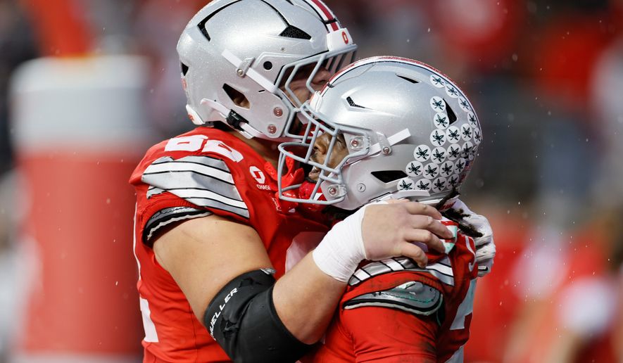 Ohio State running back Bo Jackson, right, celebrates after his touchdown against Maryland with offensive lineman Joshua Padilla, left, during the second half of an NCAA college football game, Saturday, Oct. 10, 2026, in Columbus, Ohio. (AP Photo/Jay LaPrete)