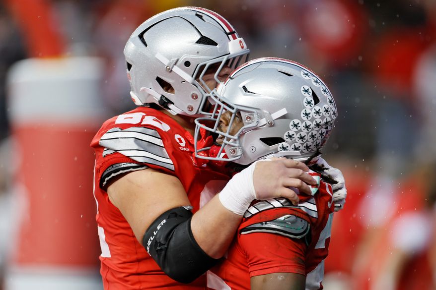 Ohio State running back Bo Jackson, right, celebrates after his touchdown against Maryland with offensive lineman Joshua Padilla, left, during the second half of an NCAA college football game, Saturday, Oct. 10, 2026, in Columbus, Ohio. (AP Photo/Jay LaPrete)