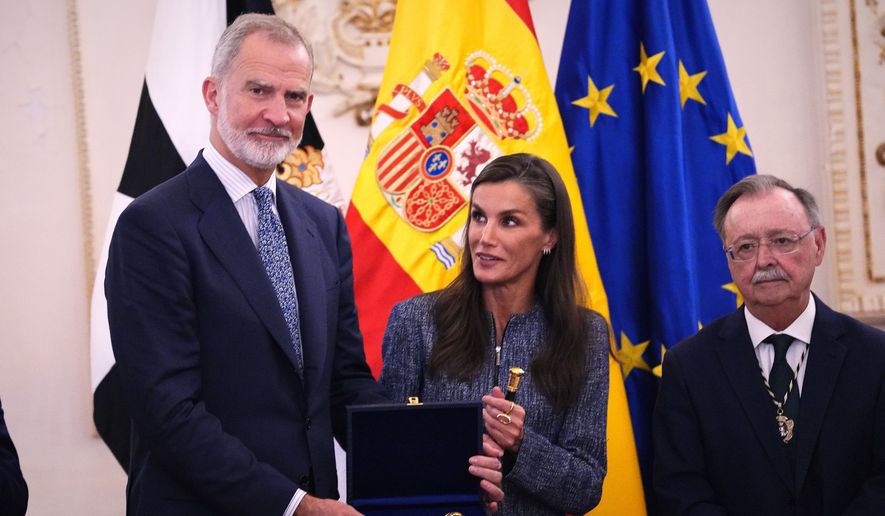 Spain's King Felipe VI and Queen Letizia are presented with the key to the city during their visit to the Spanish enclave of Ceuta, Tuesday, Oct. 13, 2026. (AP Photo/Manu Fernández)