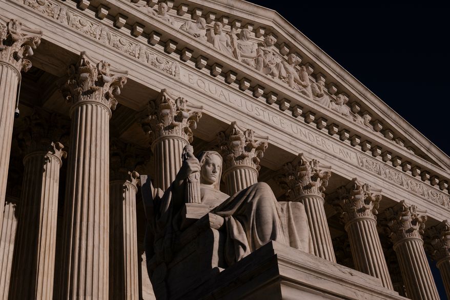 The statue Contemplation of Justice at the Supreme Court is seen at day's end in Washington, Thursday, Oct. 1, 2026, as the justices prepare to begin the new term next week. (AP Photo/J. Scott Applewhite)