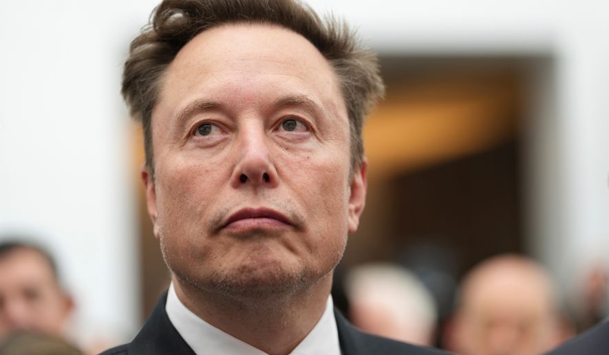 Elon Musk listens as President Donald Trump speaks during an event at the U.S. Institute of Peace, Thursday, Oct. 8, 2026, in Washington. (AP Photo/Julia Demaree Nikhinson)
