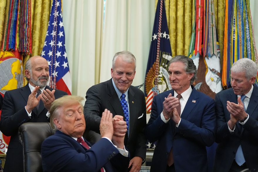 President Donald Trump shakes hands with Sen. Dan Sullivan, R-Alaska, as he speaks in the Oval Office of the White House, Wednesday, Sept. 30, 2026, in Washington, as Commerce Secretary Howard Lutnick, Interior Secretary Doug Burgum and Energy Secretary Chris Wright applaud. (AP Photo/Alex Brandon)