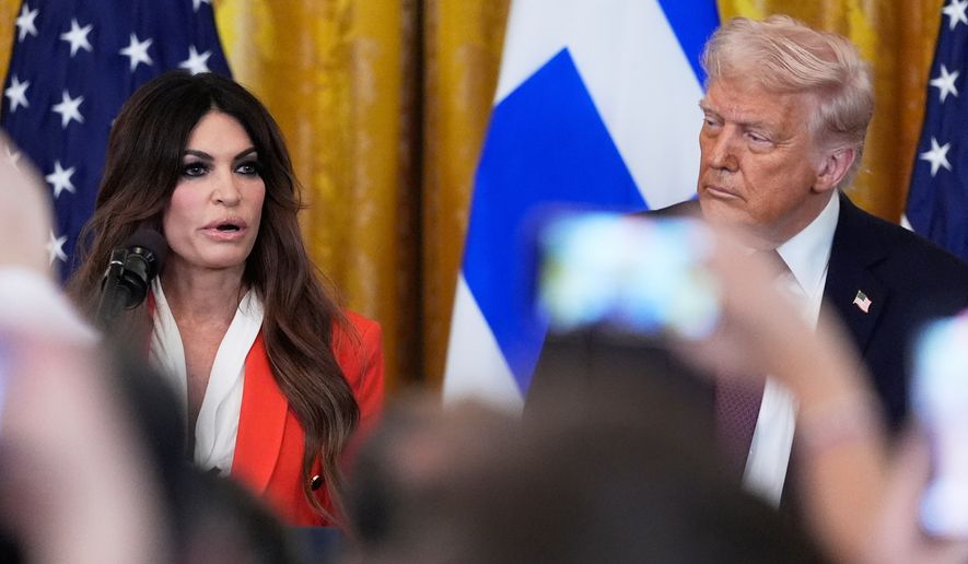 FILE - Kimberly Guilfoyle speaks as President Donald Trump listens at a reception celebrating Greek Independence Day in the East Room of the White House, March 24, 2025, in Washington. (AP Photo/Mark Schiefelbein, File)