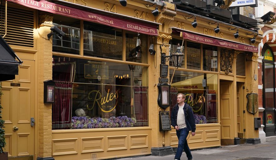 A man walks past London's oldest Restaurant ' Rules' which has been donated to Europe's biggest conservation charity in London, Wednesday, Oct. 14, 2026.(AP Photo/Alberto Pezzali)