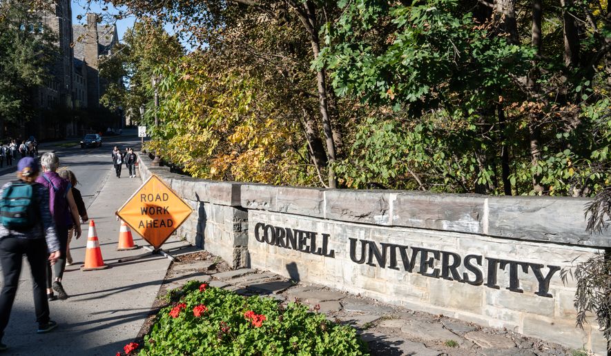 Students walk through Cornell University's campus, Wednesday, Oct. 7, 2026, in Ithaca, N.Y. (AP Photo/Matt Burkhartt)